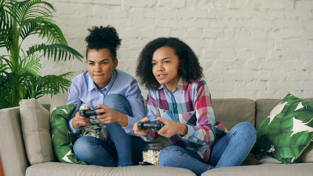 Young adults watching streaming content on a tablet in a living room